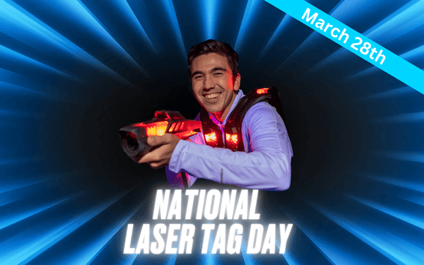 A man smiles while playing laser tag at Arena Sports Issaquah