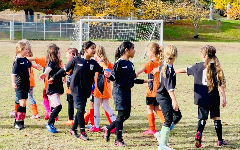 Seattle Youth Soccer Association Girls High-Fiving