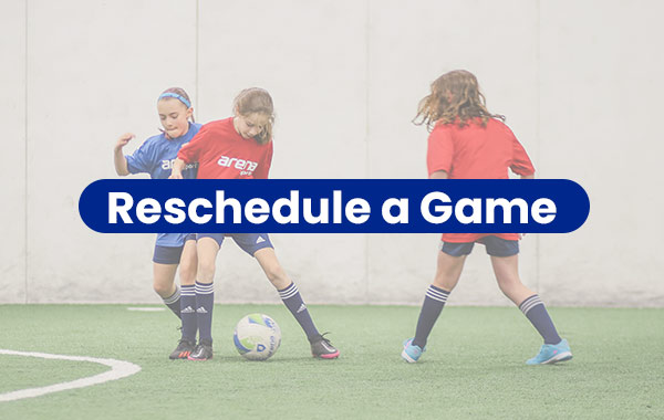 Three youth league girls battle for the ball at an indoor soccer game at Arena Sports