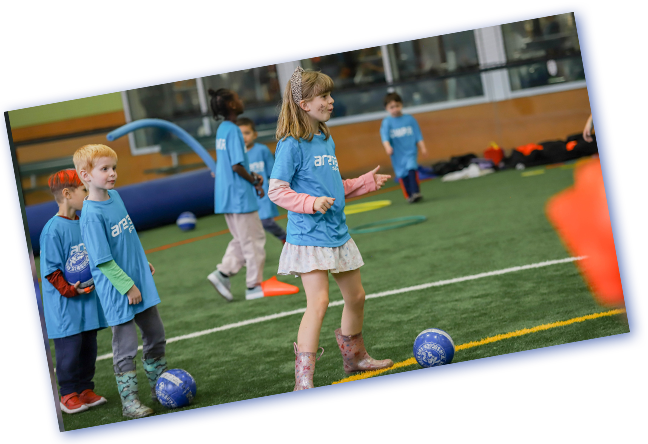 Kids play field games at Arena Sports Summer Camp